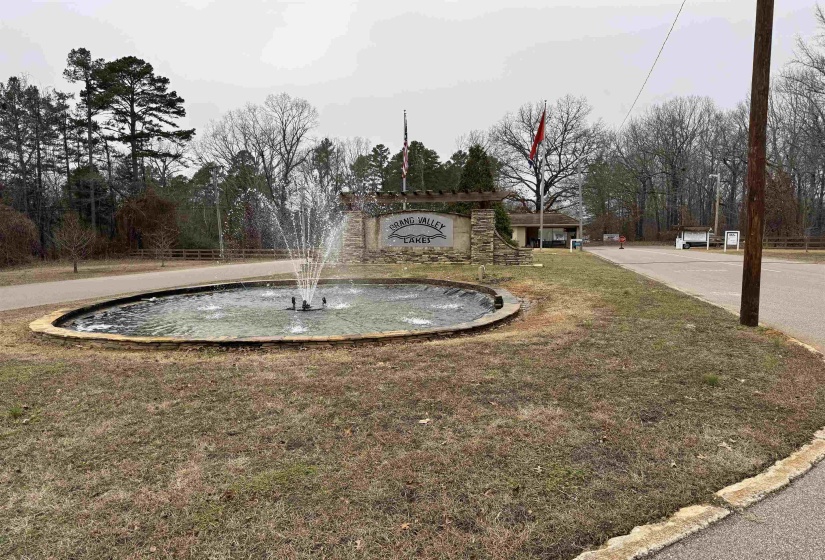View of community featuring view of wooded area