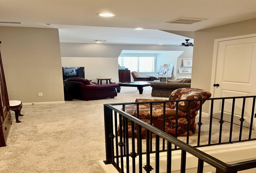 Hallway with carpet floors and recessed lighting