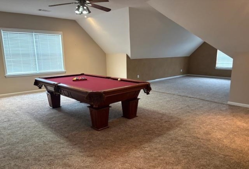 Playroom with light carpet, pool table, lofted ceiling, and ceiling fan