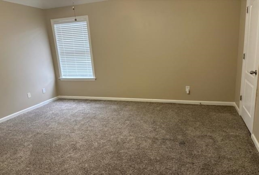 Spare room with carpet floors and baseboards