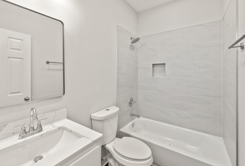 Bathroom with vanity and  shower combination