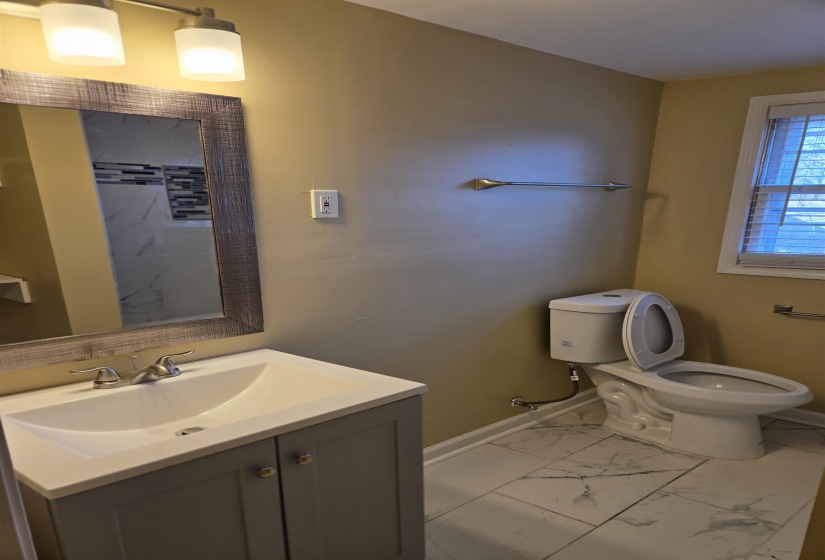 Full Upstairs Bathroom features NEW Vanity, Toilet and Tub.