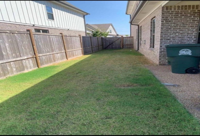 View of fenced backyard