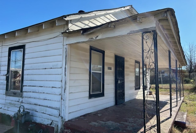 View of side of home with covered porch
