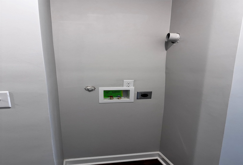 Laundry room featuring hookups for a stackable washer and electric dryer