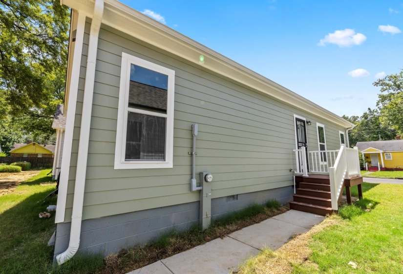 View of home's exterior featuring a yard and crawl space