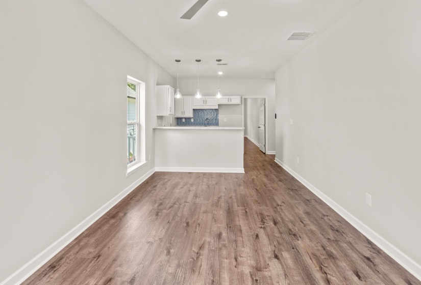 Unfurnished living room with recessed lighting, dark wood-style floors, and ceiling fan