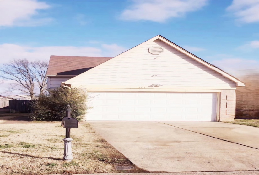 View of front of property featuring a garage