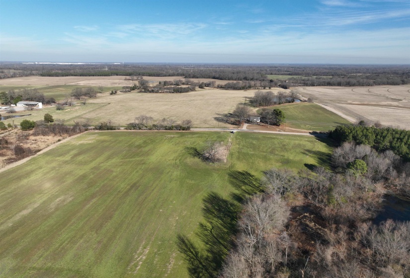 Aerial view of property and surrounding area featuring rural landscape