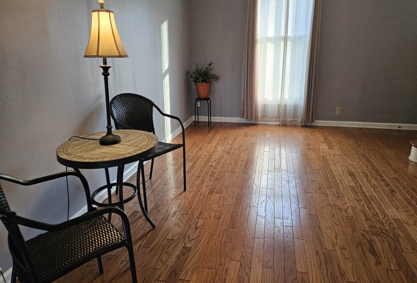 Sitting room with healthy amount of natural light and light wood-style flooring