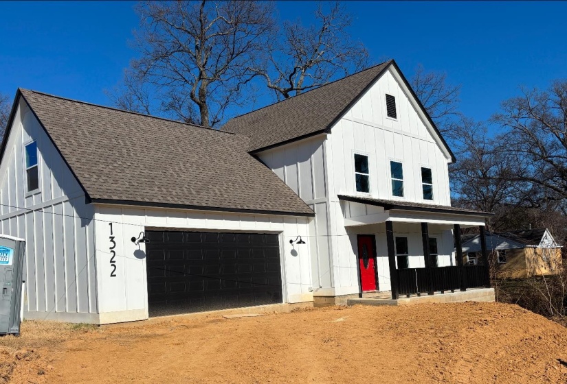 Modern farmhouse style home featuring a garage and covered porch