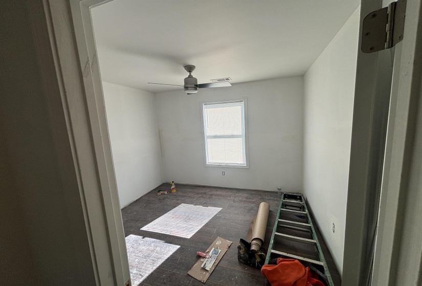 Unfurnished room featuring ceiling fan