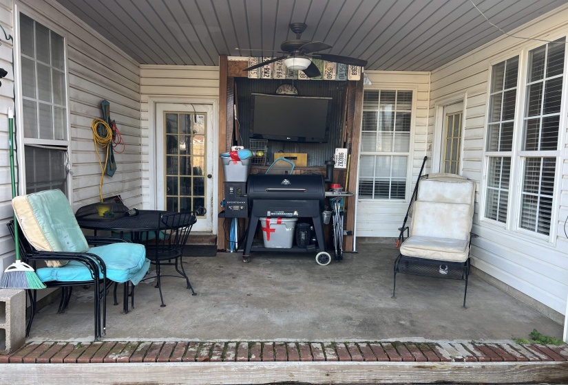 View of patio featuring ceiling fan and a grill