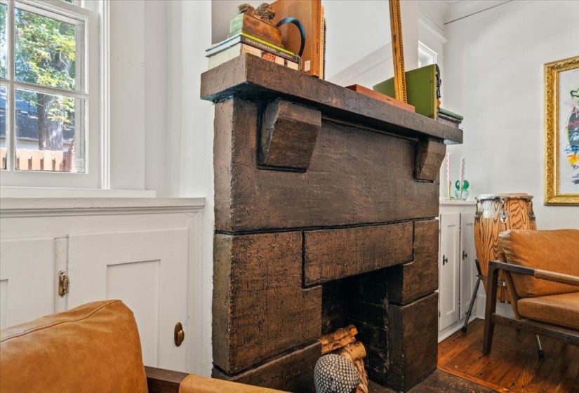 Detailed view of a fireplace and wood finished floors