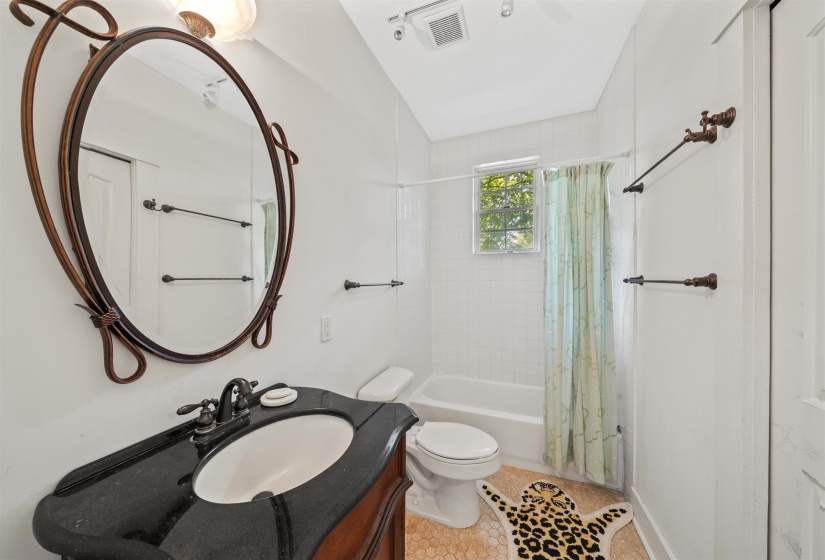 Full bathroom with vanity and shower / bath combo