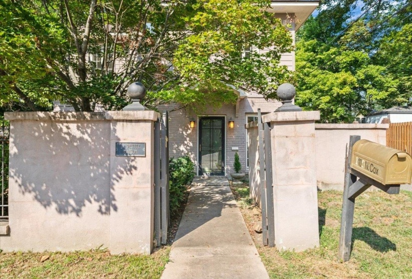 View of exterior entry with brick siding