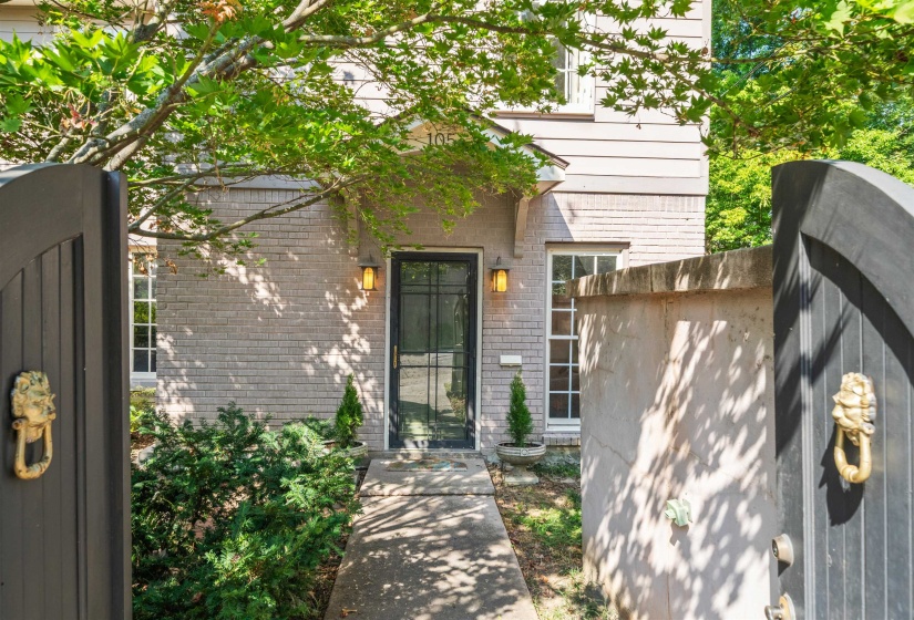 Entrance to property featuring brick siding