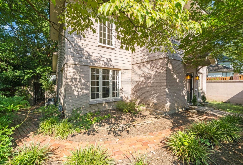 View of side of home featuring brick siding