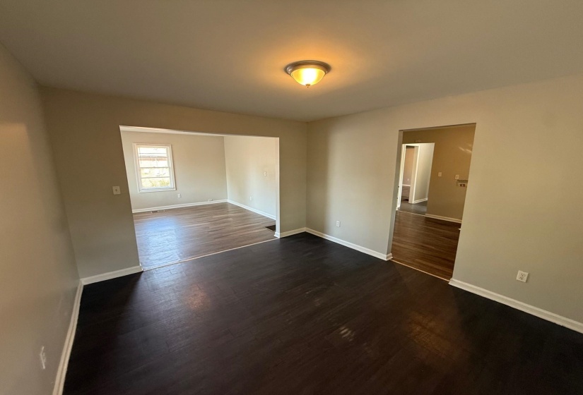 Unfurnished bedroom featuring dark wood finished floors