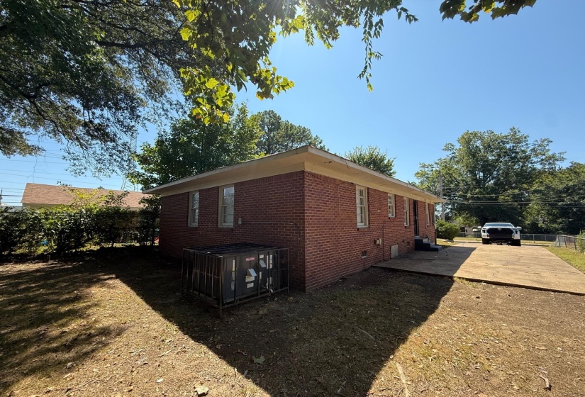 View of side of home featuring crawl space and brick siding