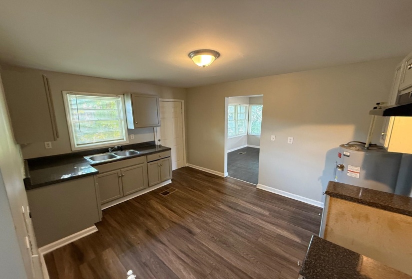 Kitchen with dark wood finished floors and plenty of natural light