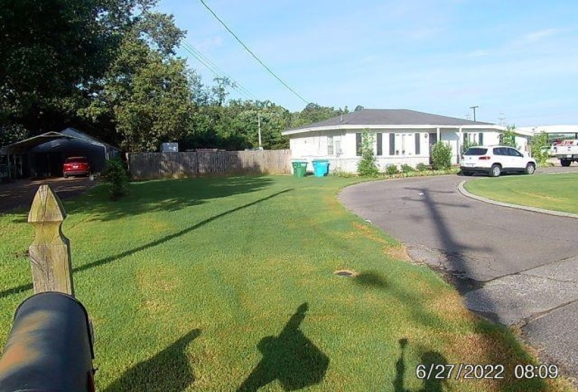 View of front of home with asphalt driveway
