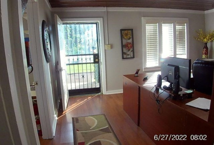 Office featuring dark wood finished floors and ornamental molding