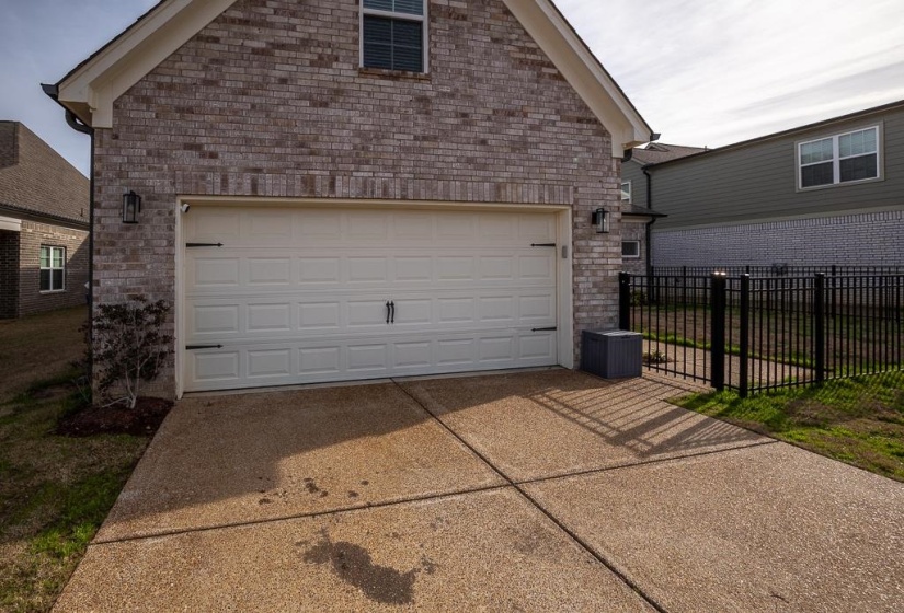 Garage with concrete driveway