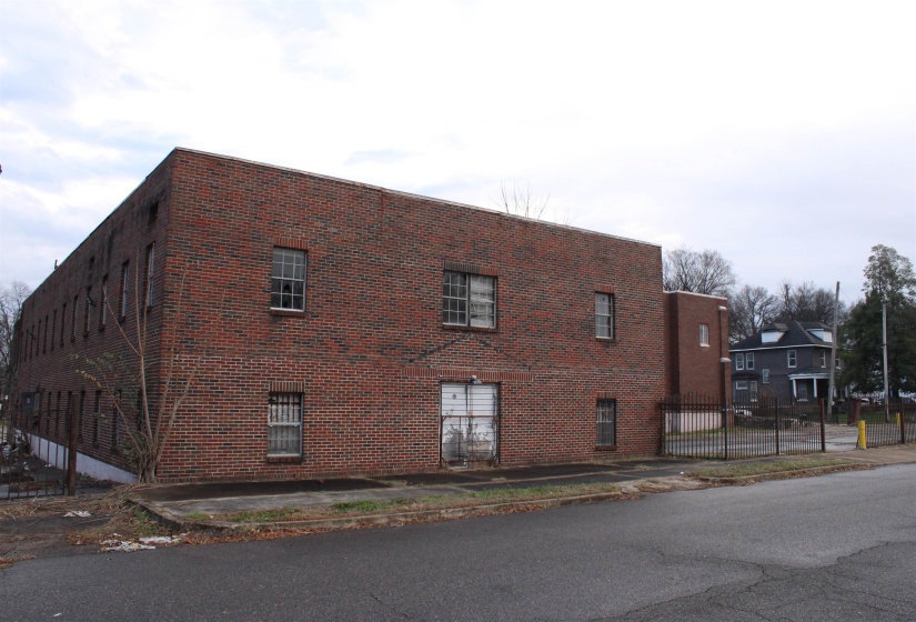 View of side of property featuring brick siding