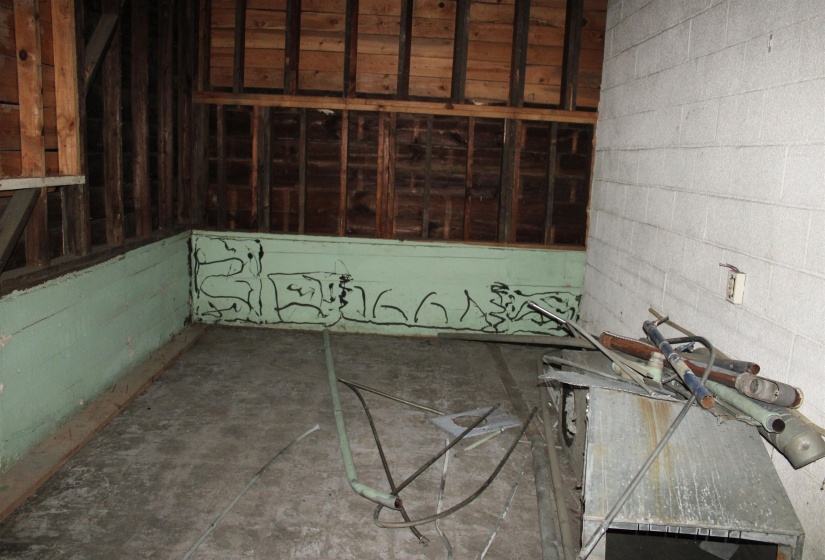 Misc room with concrete block wall