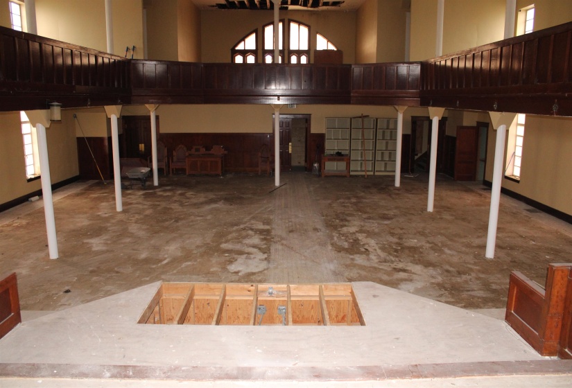 Misc room featuring plenty of natural light and a towering ceiling