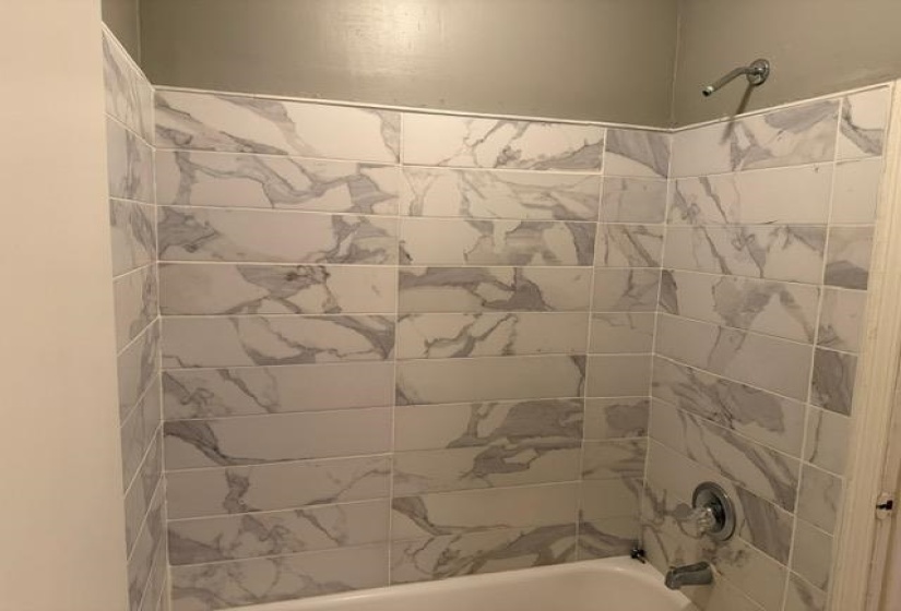 Bathroom with shower / tub combination