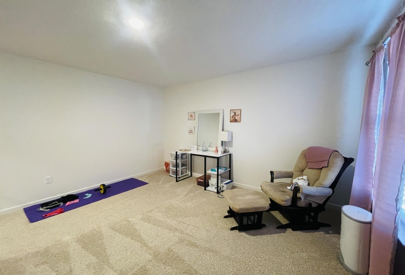 Living area with carpet and baseboards