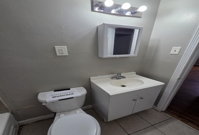 Bathroom featuring vanity and light tile patterned floors