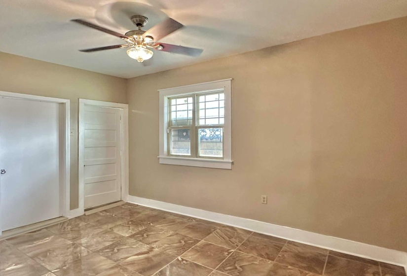 Unfurnished bedroom featuring ceiling fan and a closet