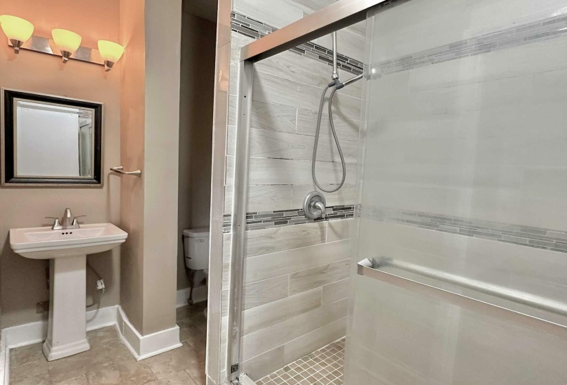 Full bathroom with a stall shower
