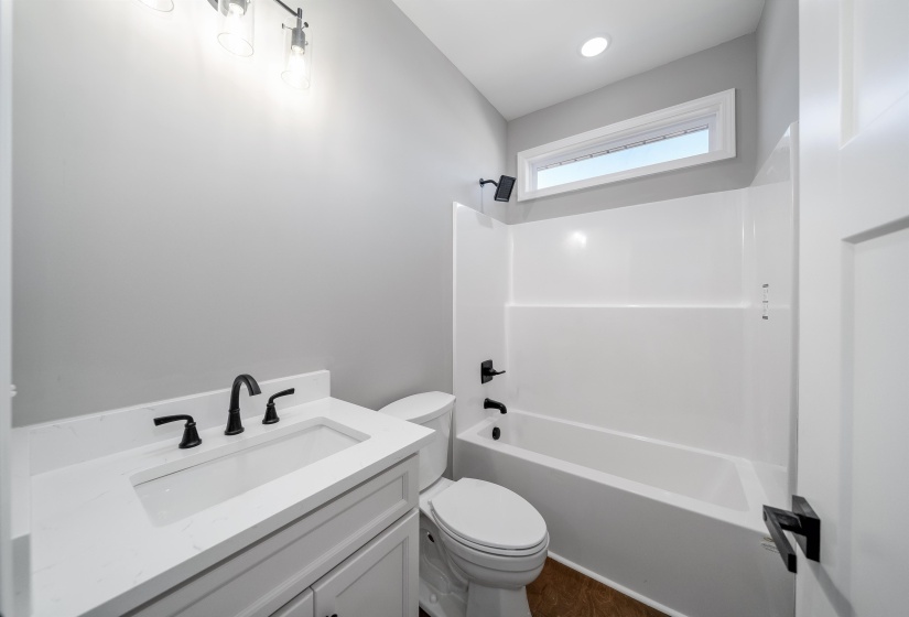Bathroom featuring vanity and tub / shower combination