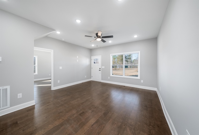 Spare room with recessed lighting, dark wood-style flooring, and ceiling fan