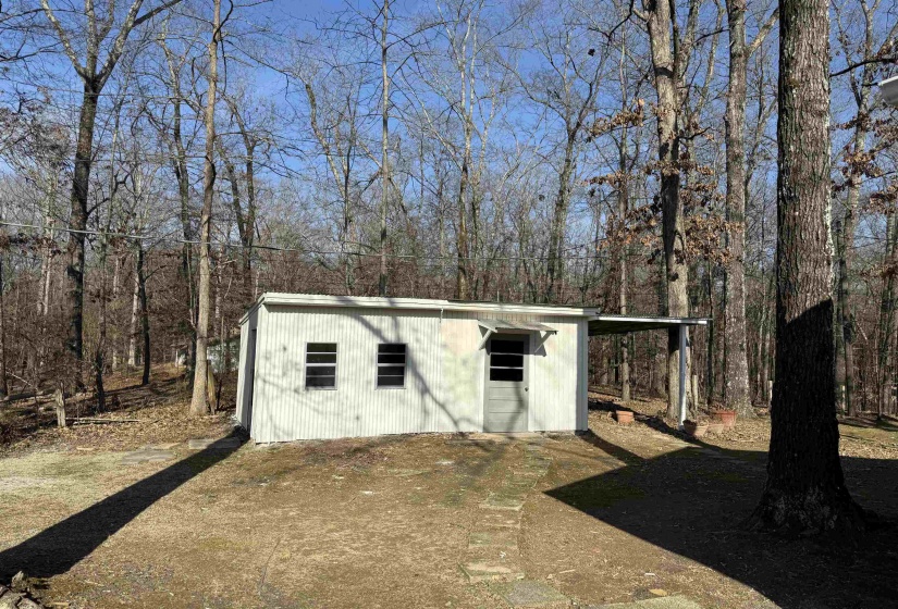 View of outdoor structure with a forest view