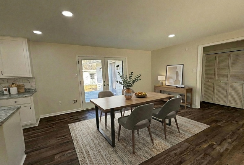 Dining room featuring french doors, recessed lighting, and dark wood finished floors