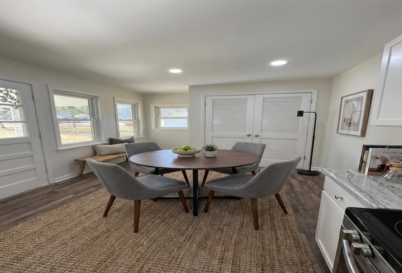 Dining room featuring dark wood finished floors, recessed lighting, and french doors