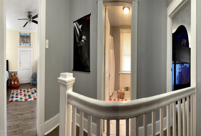 Second-story landing with white painted balustrade and banister