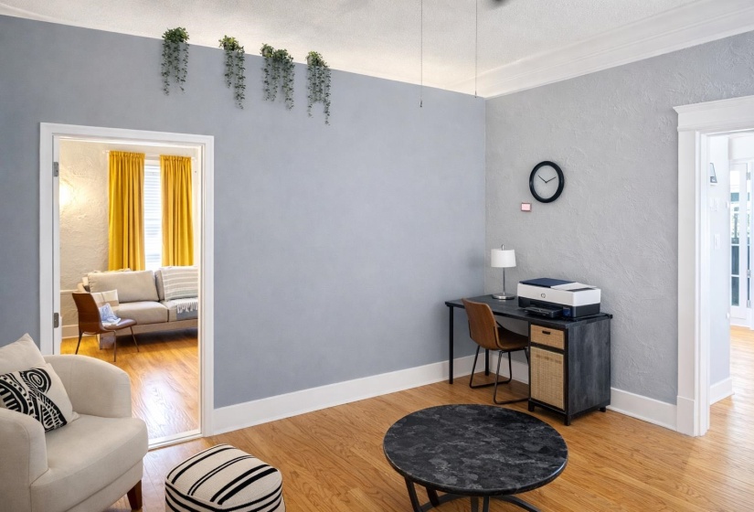 Hardwood-finish flooring throughout, featuring crisp white baseboards and trim