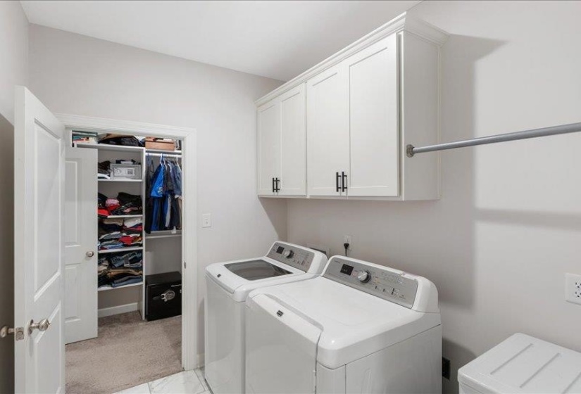 Convenient laundry room with direct access from primary suite.