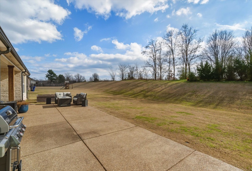 View of patio with area for grilling and outdoor lounge area