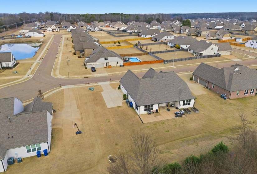Elevated neighborhood view highlighting the community layout, surrounding homes, and open green space.