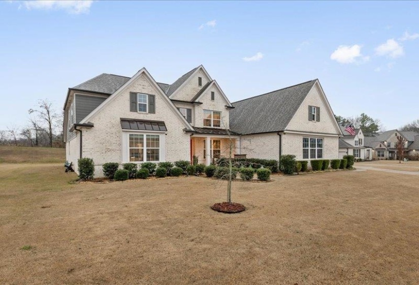 Angled exterior view highlighting curb appeal and spacious lot.
