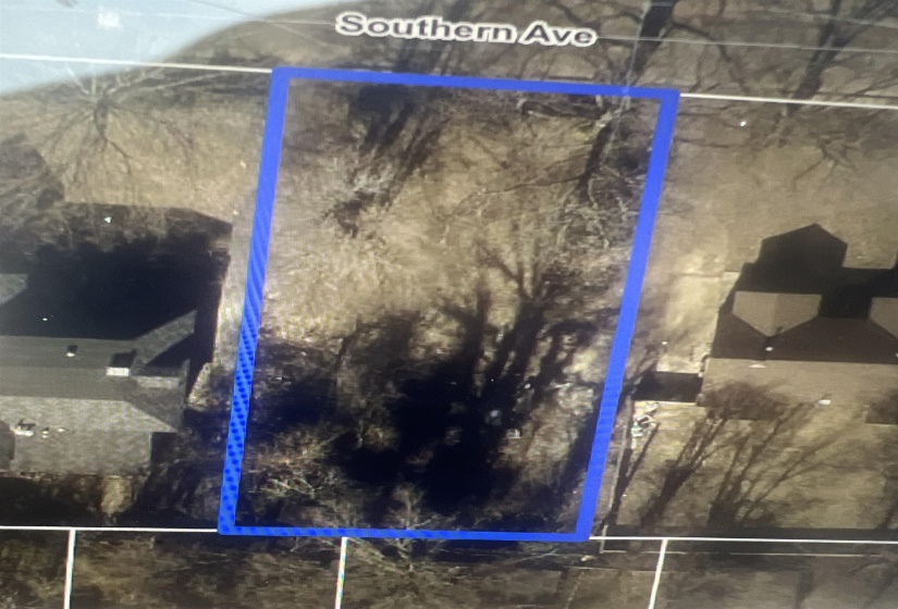 Aerial overview of property's location with property parcel outlined