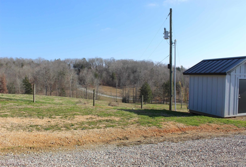 View of yard with a storage shed
