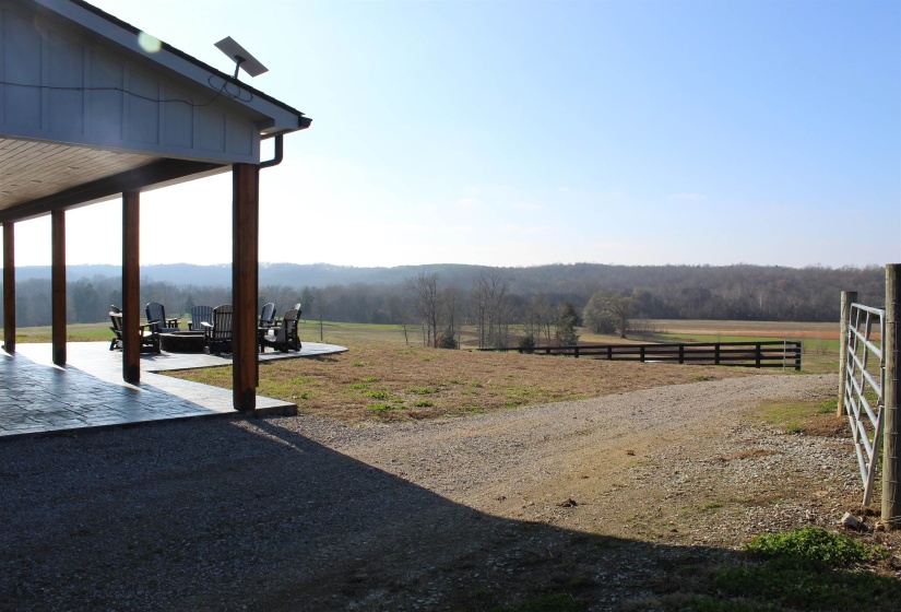 View of yard with a patio and a rural view
